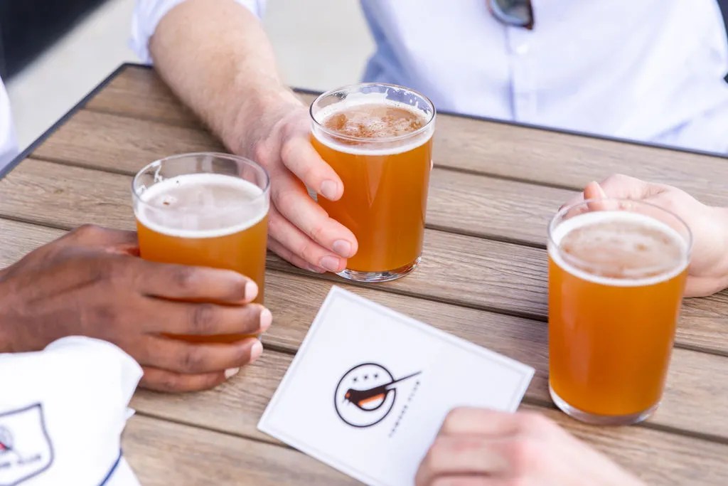 Diners with beverages at patio seating