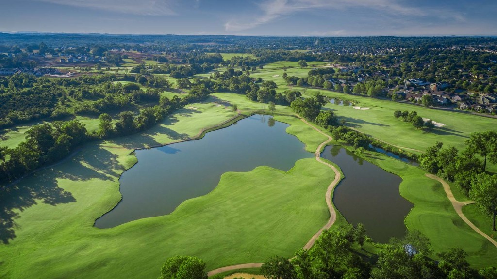 Bird's eye view of golf course with ponds